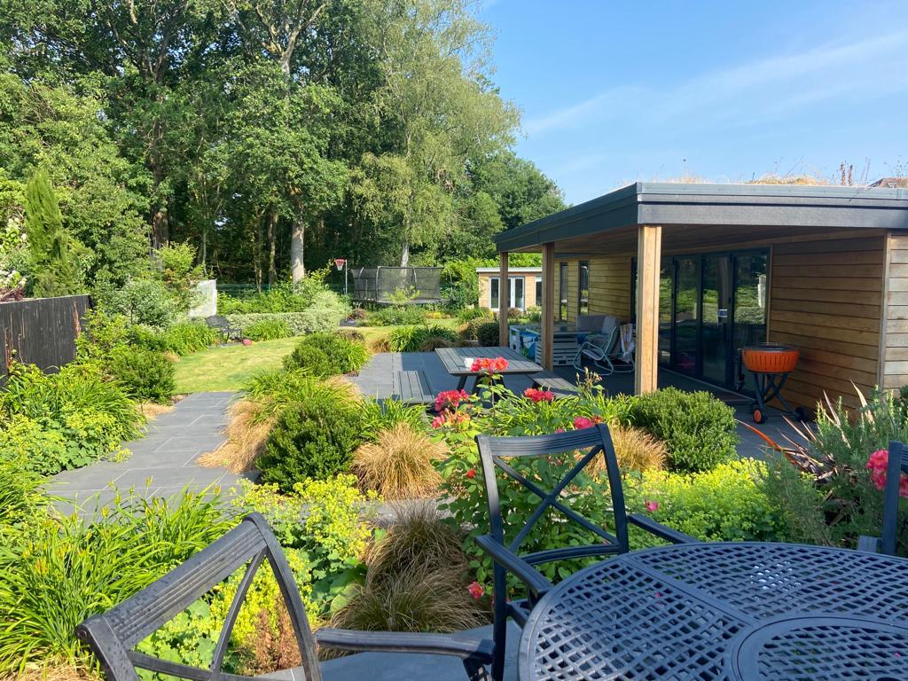 Slate paths, garden room and mature planting